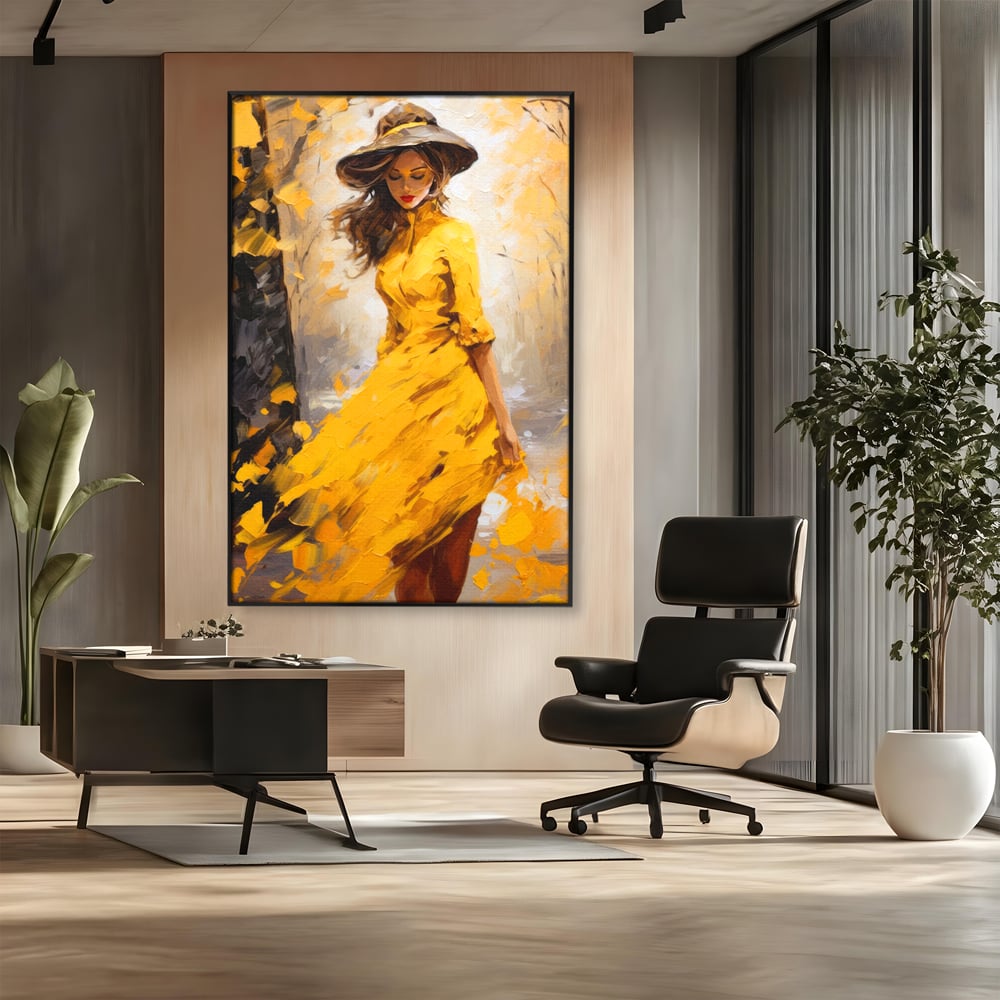Tablou canvas cu tablou canvas cu femeie in galben, in rama de aluminiu negru, pe perete intr-un birou